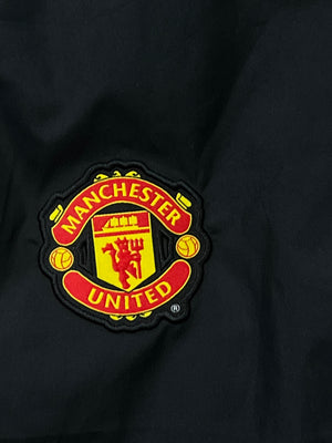 vintage Nike Manchester United trackpants {S}